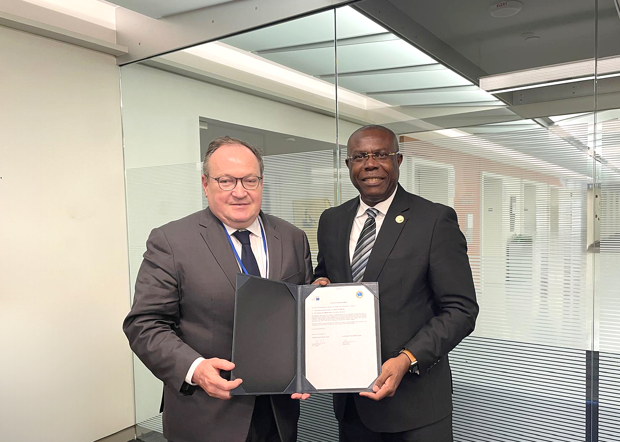 EIB Vice-President Ambroise Fayolle and CDB President Isaac Solomon stand side by side