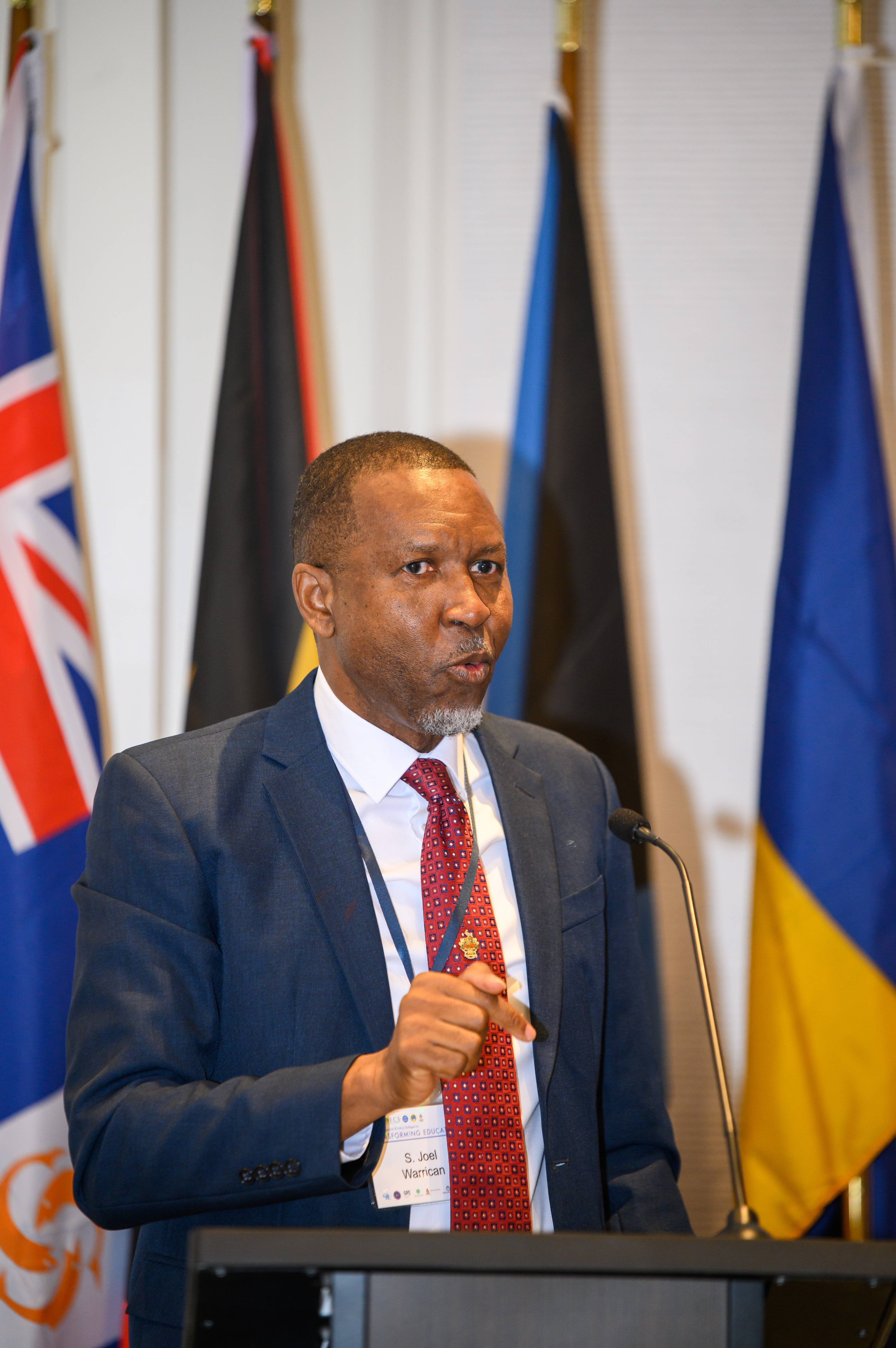 Professor Joel Warrican at the lectern