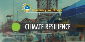 screen capture of video slide with city of Georgetown, Guyana as backdrop with the words Climate Resiliencehighlighted