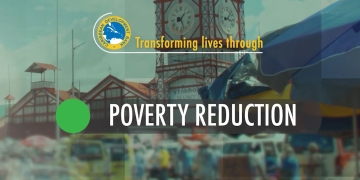 screen capture of video slide with city of Georgetown, Guyana as backdrop with the words Poverty Reduction highlighted
