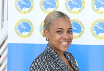photo of young female smiling in front of CDB branded backdrop