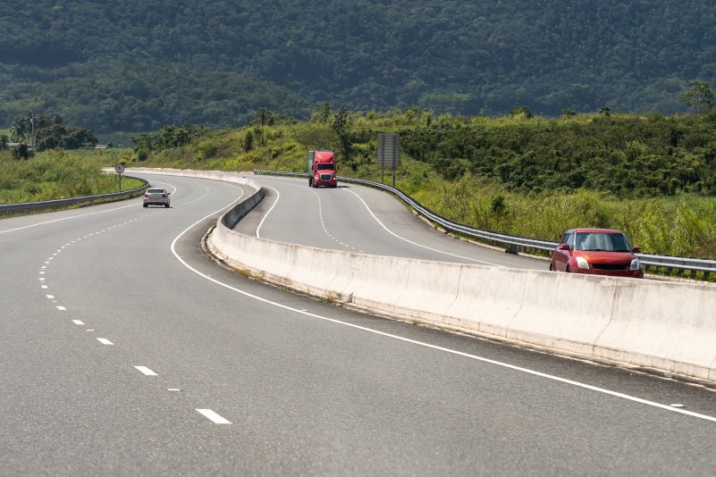 Trucks and cards on a highway